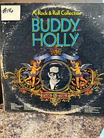Front cover of Buddy Holly “A Rock & Roll Collection” album showing artwork and wear