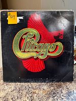 Front cover of Chicago LP showing logo and bird graphic, wear along edges