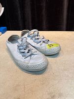 Oblique view of both shoes showing uppers, laces and toe caps