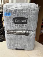 Front view of sealed Depend Fresh Protection underwear pack