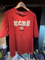 Front view of red Ecko Unltd T-shirt showing logo and overall condition
