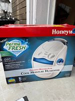 Front of boxed Honeywell cool-moisture humidifier