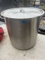 Pot with lid in place showing exterior and handle