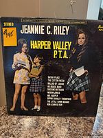 Front sleeve of Jeannie C. Riley Harper Valley P.T.A. LP showing title, artist, imagery, track list