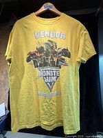 Front view of yellow Monster Jam vendor T-shirt