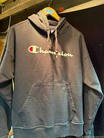 Front view of Champion hoodie showing logo and pocket