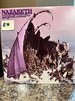 Front cover of Nazareth Hair of the Dog LP showing artwork and price sticker