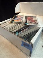 Open two-row white card box filled with 1991-92 Parkhurst hockey cards, two sleeved cards displayed on top