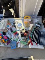 Overview of entire tray with threads, hooks, notions