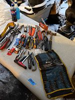Full spread of assorted hand tools on table