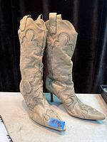 Full view of both boots upright