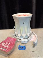 Scentsy ceramic electric wax warmer with cord and wax bar front view