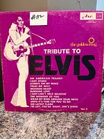 Front cover of Tribute To Elvis Vol.2 LP showing title, artist silhouette and track listing