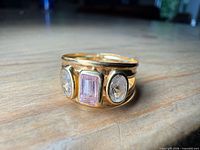 Full view of ring showing stones and band