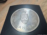 Silver medallion obverse with Canadian coat of arms