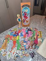 Full set displayed: doll, outfits, box