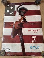 Front view of entire poster with Buckwheat image and text