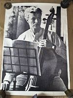 Front view of full poster showing Bowie with cello