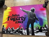 Full view of John Fogerty 1969 poster on table