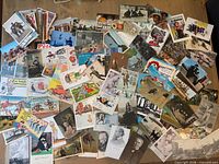 Wide view of entire spread of vintage postcards