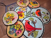 All seven hooked rug items laid out