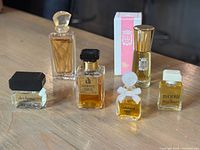 Group shot of all six miniature perfume bottles