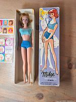 Midge doll in box with booklet covers visible