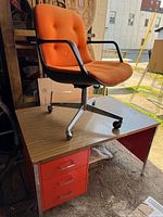 Desk with chair on top showing overall design and colors