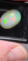 Opal showing green and red flashes