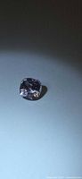 Cushion cut spinel front view under angled light
