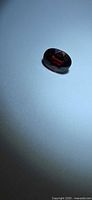 Top view of oval red garnet loose stone