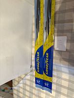 Two sealed Goodyear 26" wiper blades on table