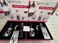 Two Vinturi wine sets boxed and opened to show contents