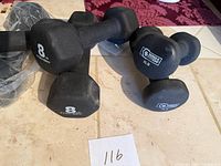 Three pairs of dumbbells showing 8 LB hex and 5 LB round weights