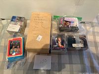 Overview of all card sets including SkyBox box, Atlas case, A-Team, Batman and Terminator stacks