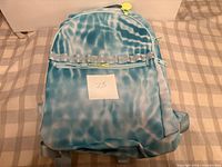 Front view of one Ecotech Riley backpack showing tie-dye pattern