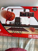 Front view of boxed Sports Toy basketball hoop set with scoreboard