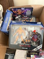 Boxed Savage He-Man figure showing contents and packaging