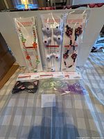 Front view of sealed necklaces and glasses