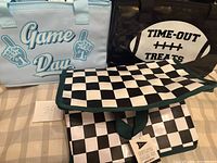 Light blue, black, and checker coolers grouped