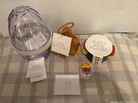 Lot overview showing egg cooker, holder, slicer, timer