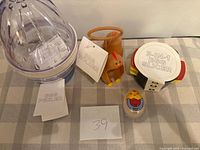 Egg peeler, egg holder, egg slicer, egg timer displayed together