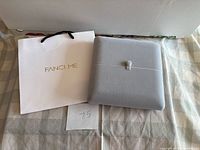 Bag and closed presentation case numbered 75