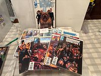 Front and top view showing upright and stacked Inhumans comics, all bagged and boarded