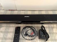 Soundbar, remote, audio cable, power adapter