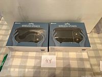 Front view of two sealed Vivitar Netra Wireless Speaker boxes