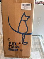 Front of sealed box showing Pet Stairs graphic and text