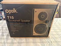 Front of retail box showing Polk branding and T15 model