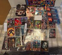 Overall view showing binder pages, sealed Independence Day sets, Wizard poster, and stacks of cards