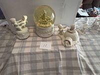 Front view of three Snowbabies pieces